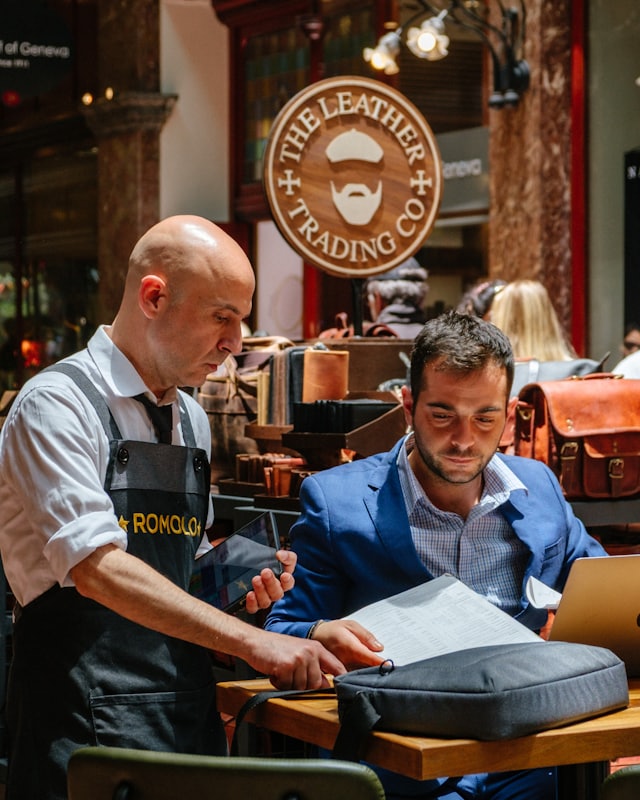 Small-business owners reviewing paperwork